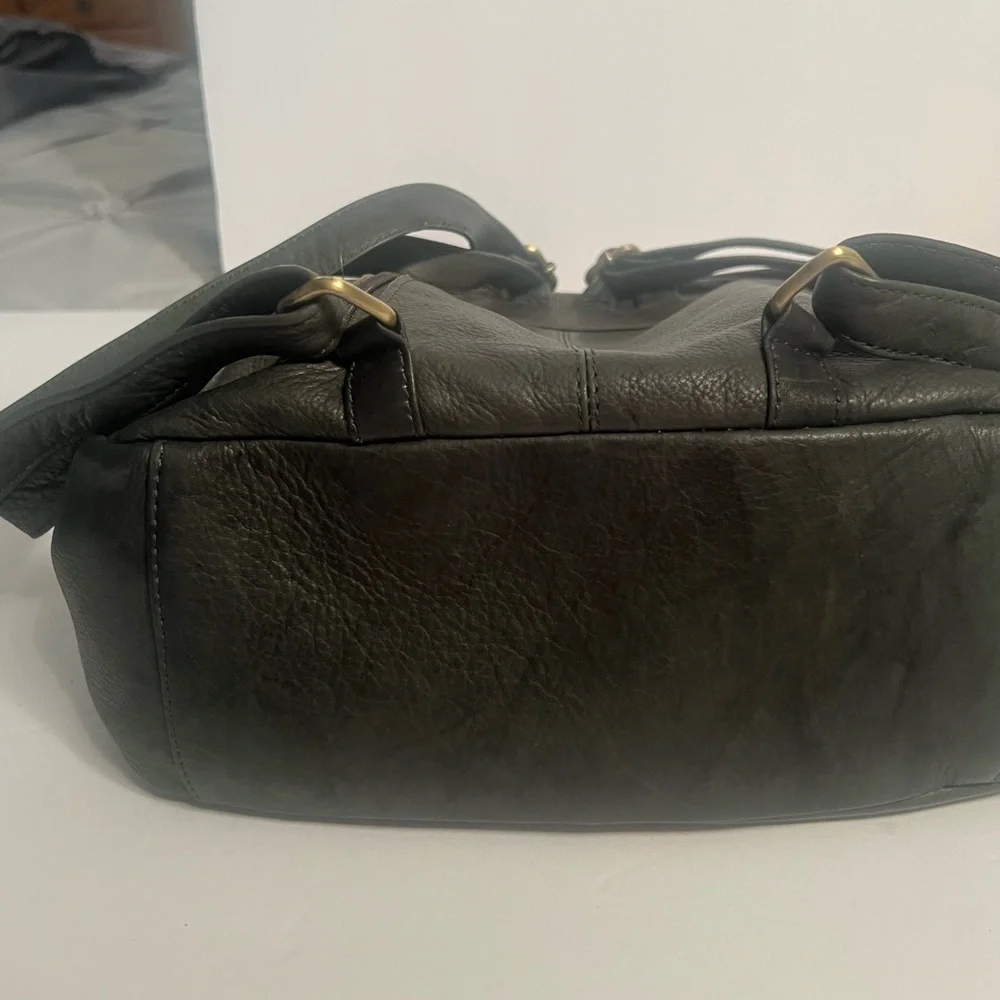 Green Backpack with Rugged Design and Leather Material